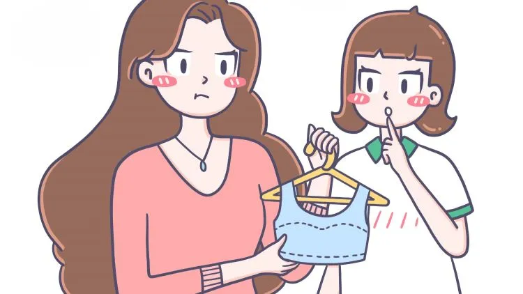 A cartoon image of a Mom and a concerned expression holding a training bra on a hanger, while a daughter gestures to keep quiet.